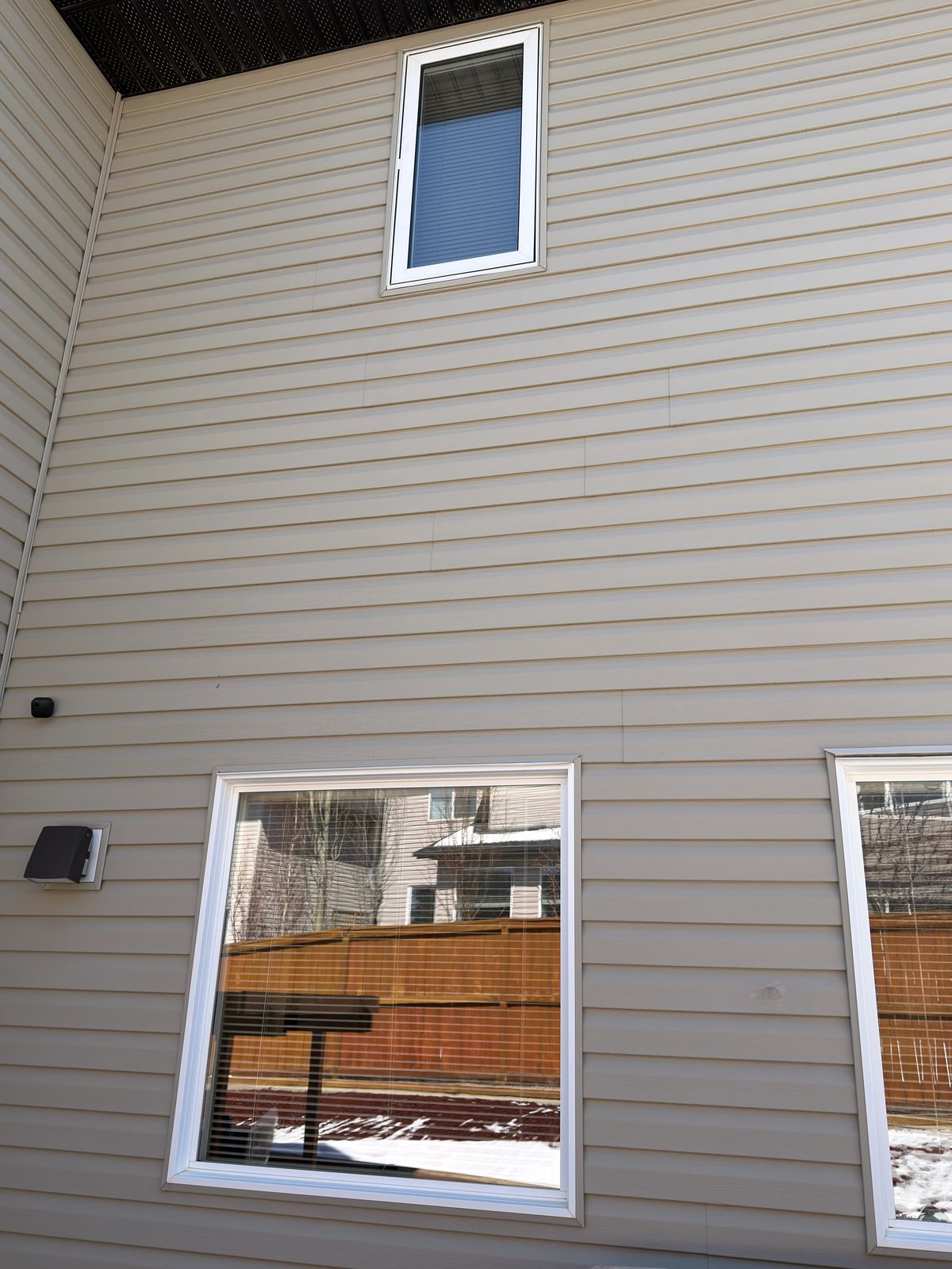 Tall wall of windows on a Calgary home after a full exterior clean
